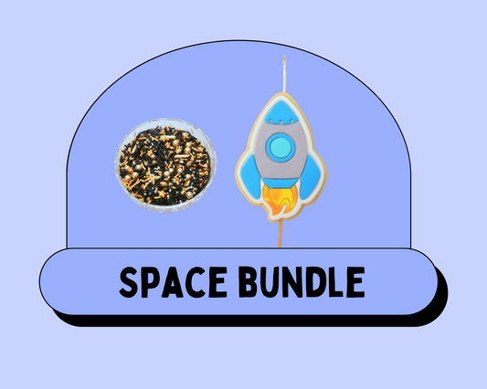 Space-themed edible Cake Decorating Bundle bundle with a rocket and sprinkles on a light blue background