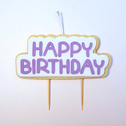 Purple Happy Birthday Cookie Candle on a white background