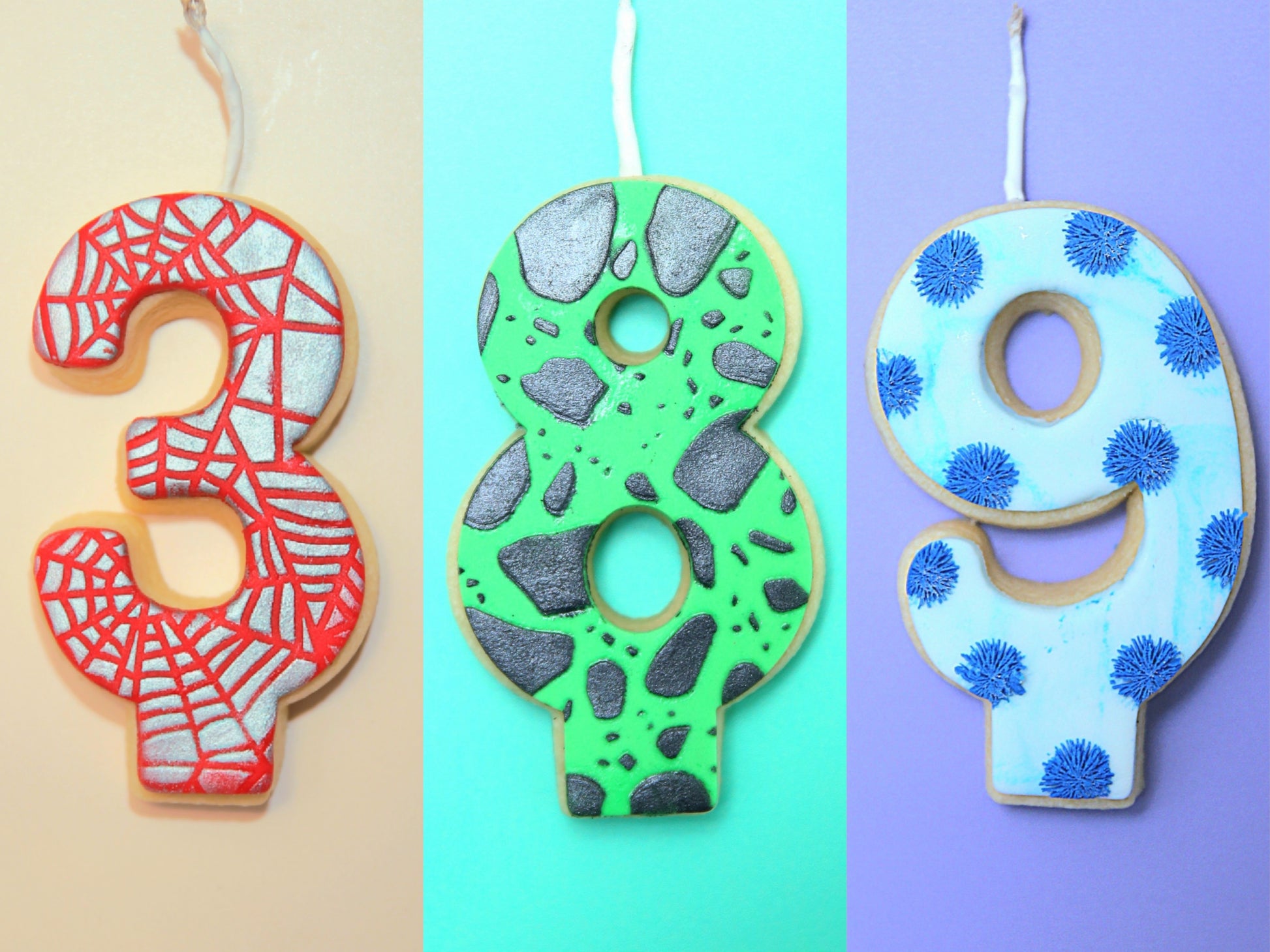 Three decorative cookies shaped like numbers 3, 8, and 9 on a beige, blue, and purple background.