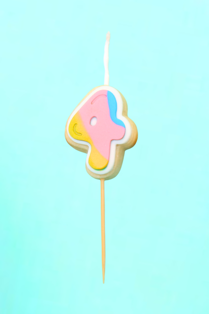 Colorful number 4 cookie on a stick against a light blue background