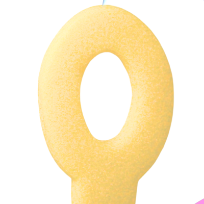Yellow number '0' cookie candle on a colorful background