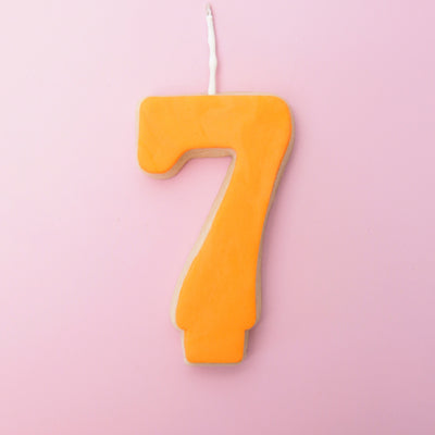 Orange number 7 cookie candle 